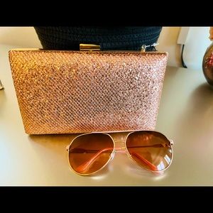 Date night approved ! Dazzle in this rose gold bag with optional gold chain